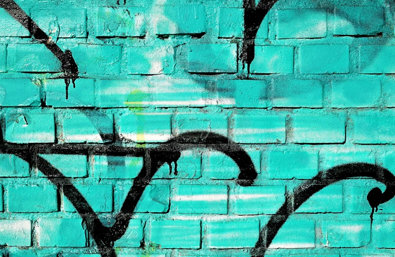 graffiti on the side of a brick wall