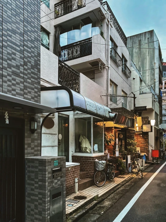 an empty street surrounded by tall buildings