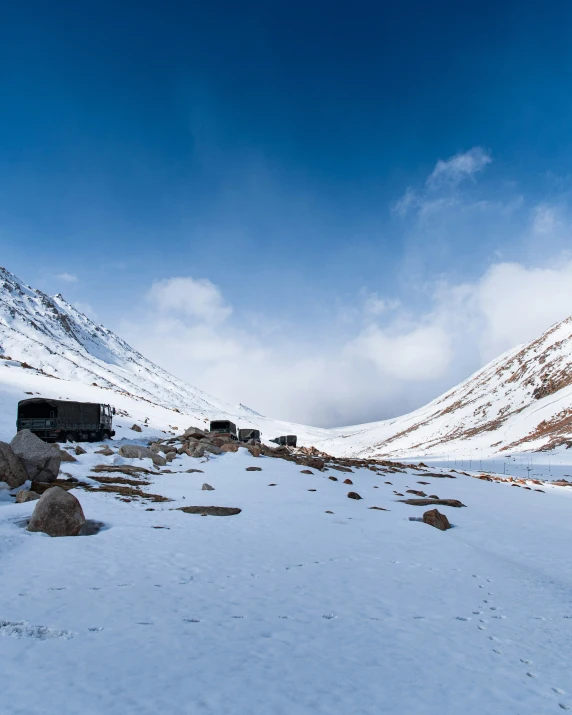 a large snow covered hillside with lots of rocks