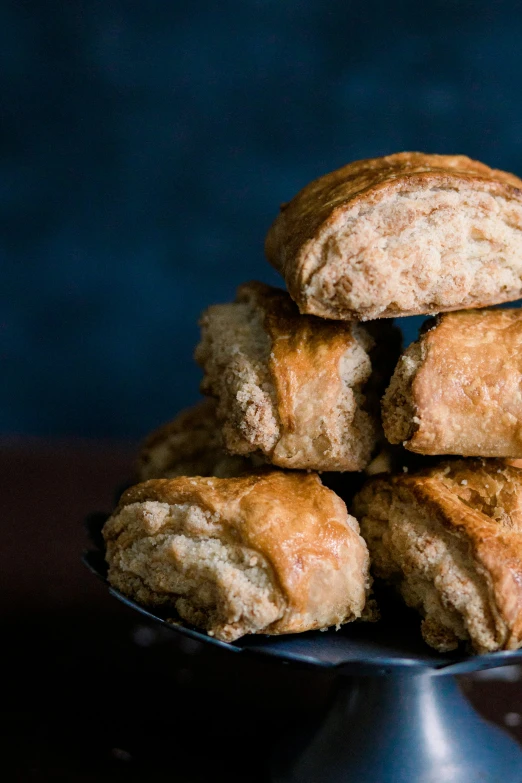 a silver plate topped with lots of fried pastry