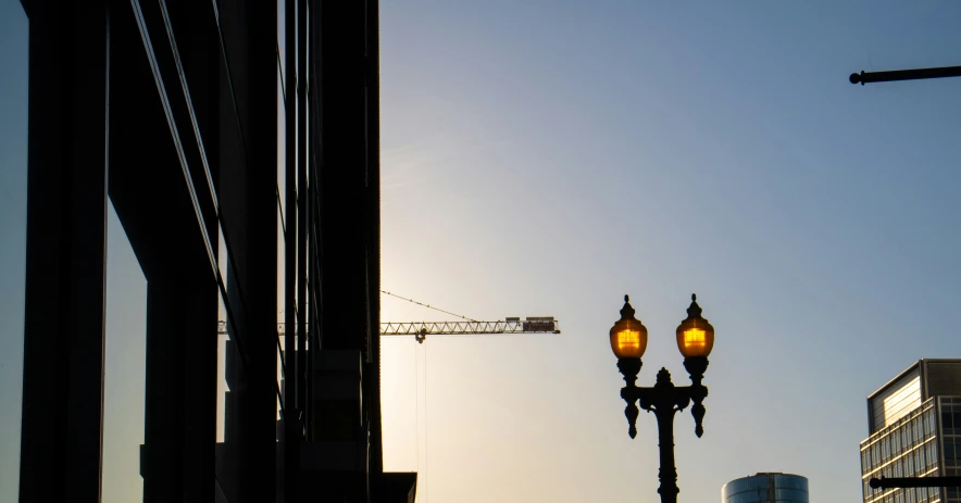 a street light with a building in the background