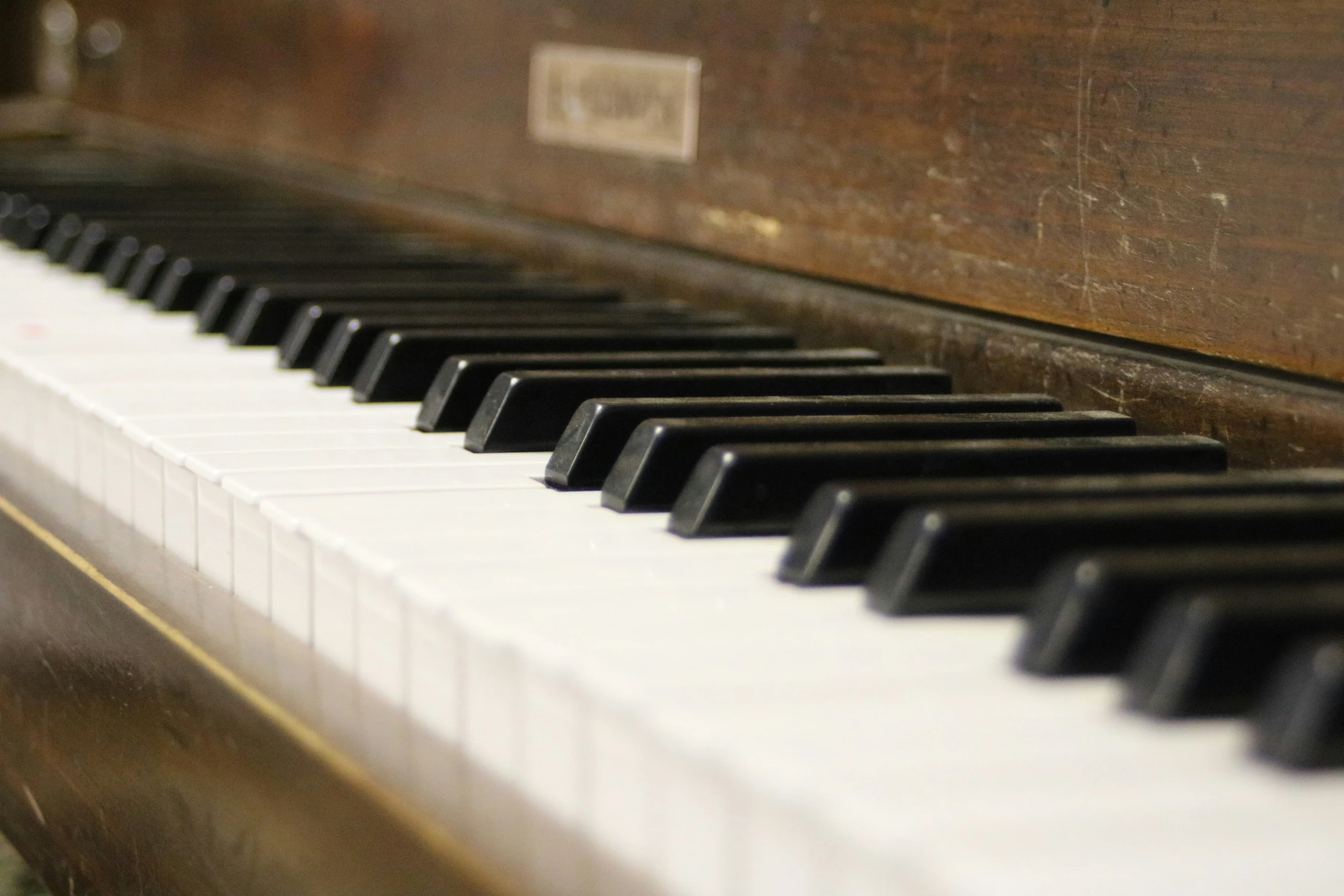 piano with white and black keys and some gold detail