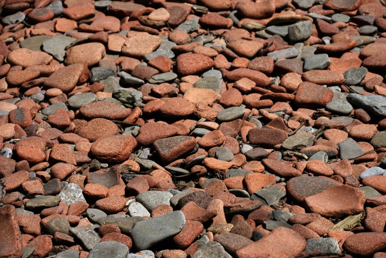 a pile of rocks and gravel in a field