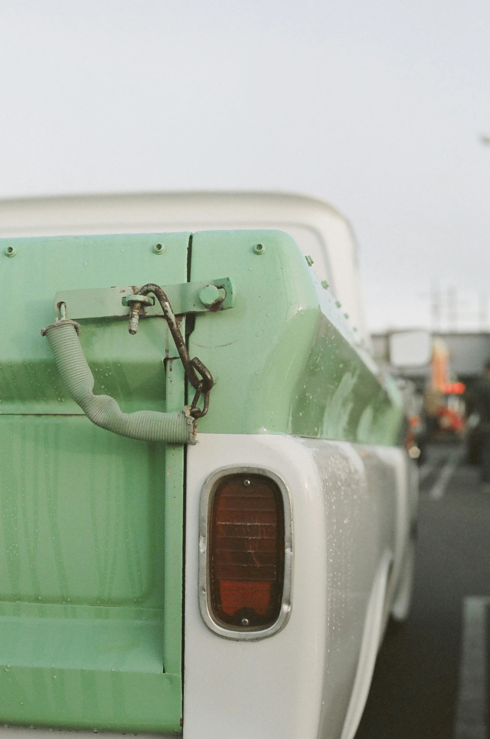 an old green and white pick up truck is shown