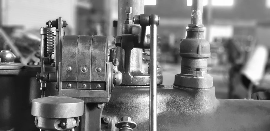 a close up view of pipes and valves on a machine