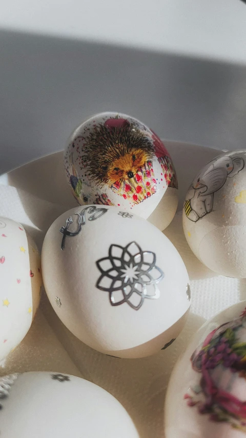 a bunch of eggs with different patterns and colors on them