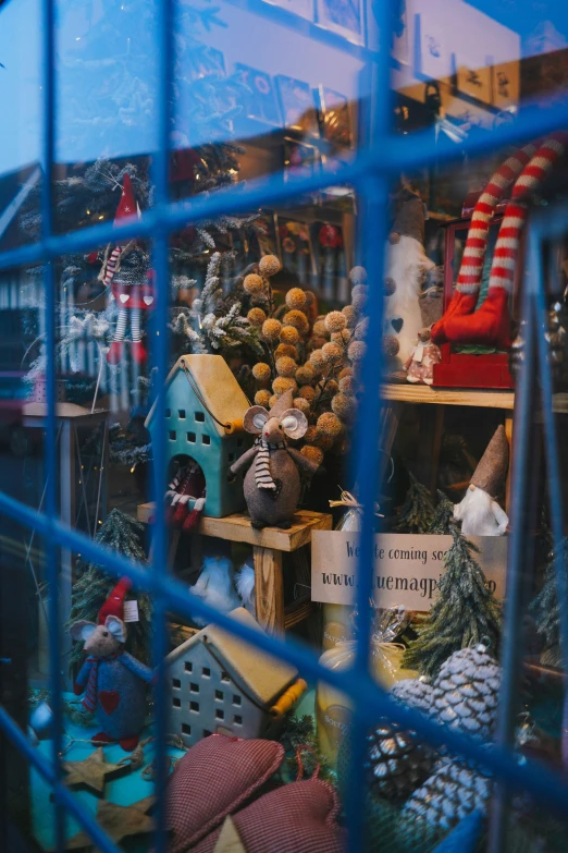 a window filled with assorted items on display