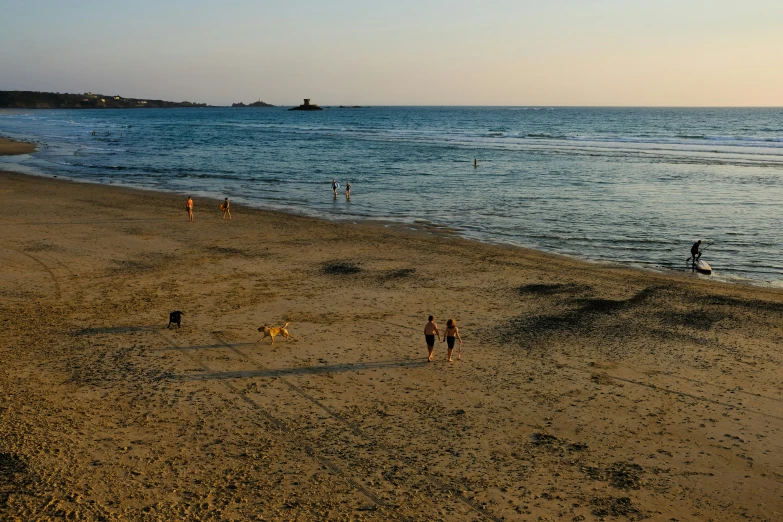 many people on the beach on a clear day