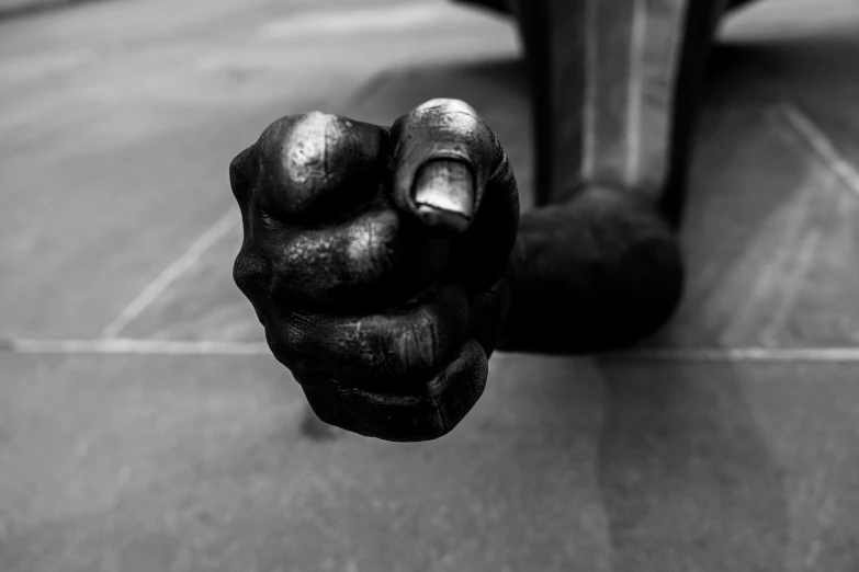 a close up of a person holding soing in one hand