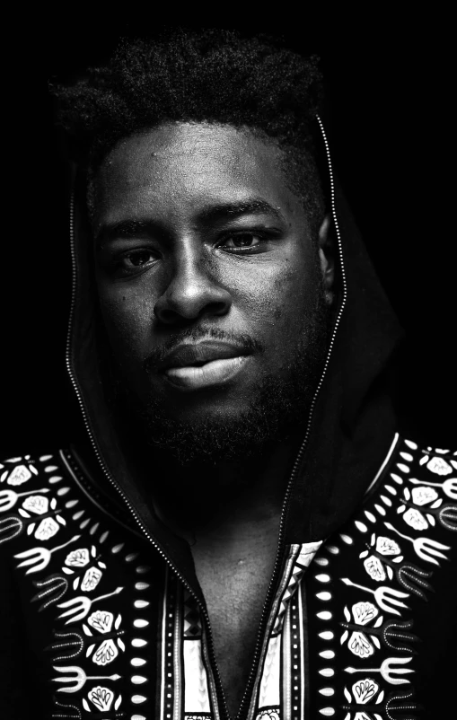 black and white image of a man with a hoodie