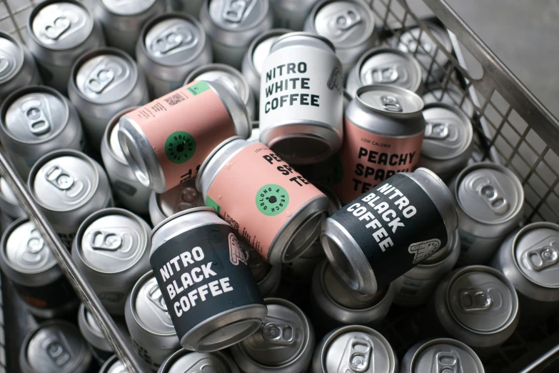 a close up of several cans of different types of coffee