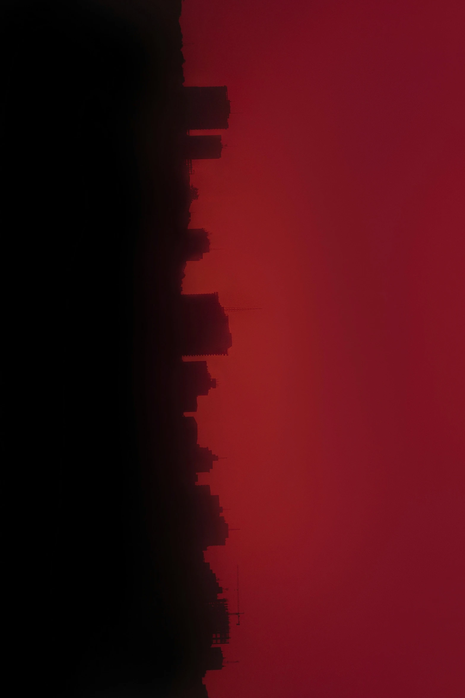 a red picture with dark area next to a black space