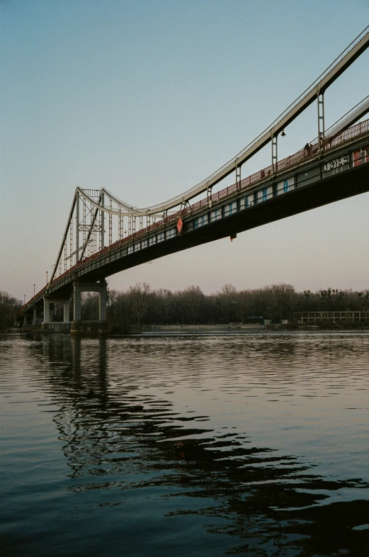 a train is crossing a bridge over the water