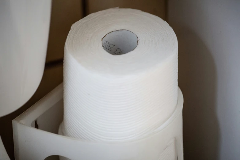 a white toilet paper in a cardboard box