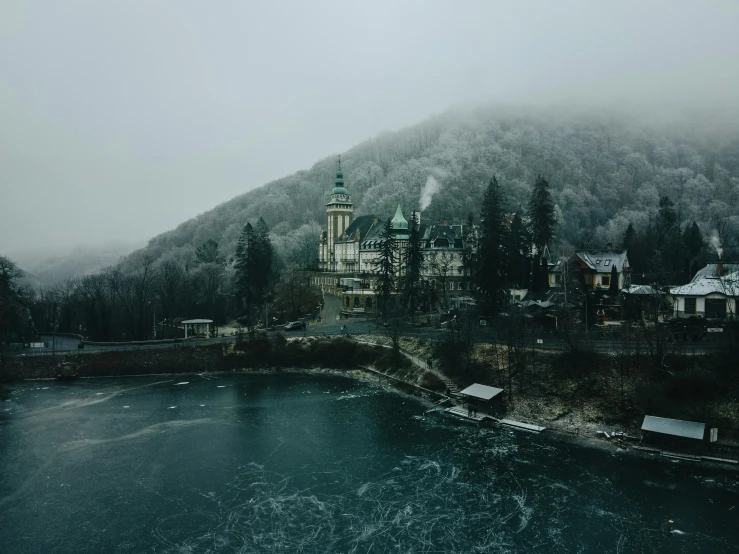 a castle and mountain with houses near it