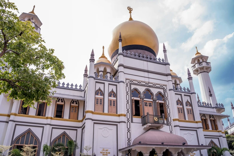 an ornate building is shown with many columns and domes