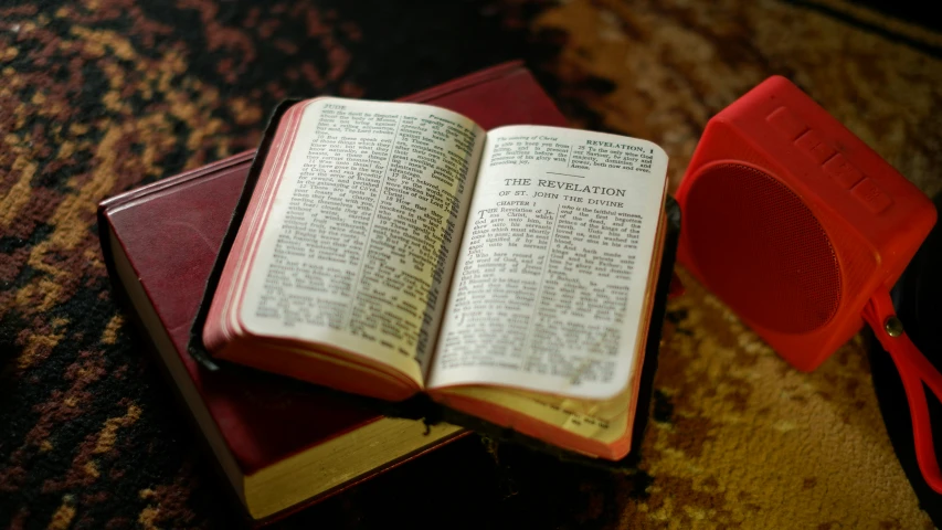 two books with glasses on top of them