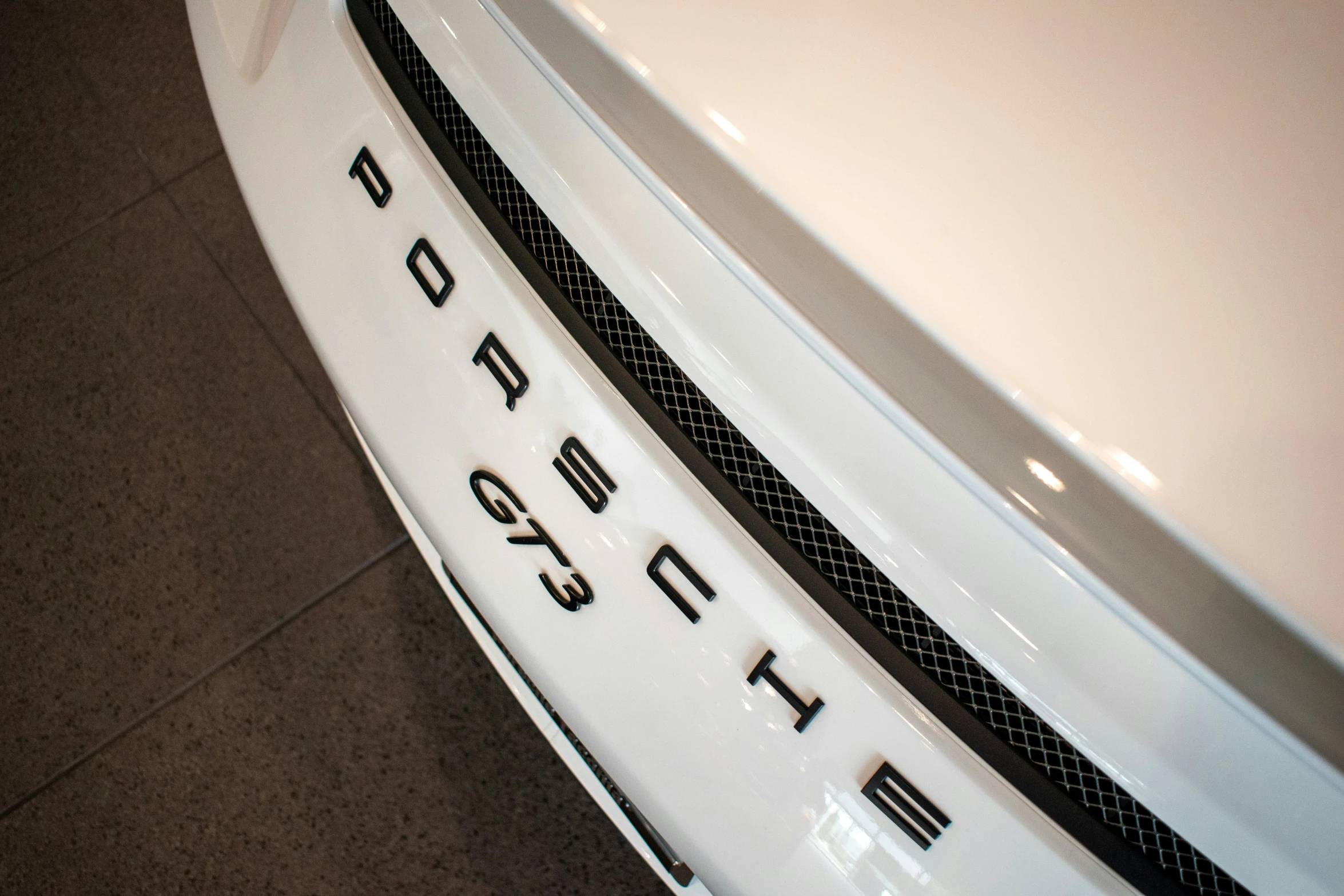 a close up view of a white car door emblem