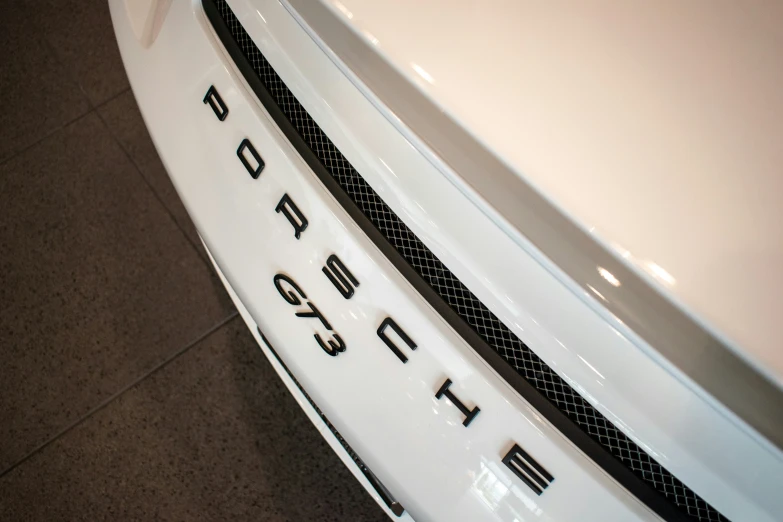 a close up view of a white car door emblem