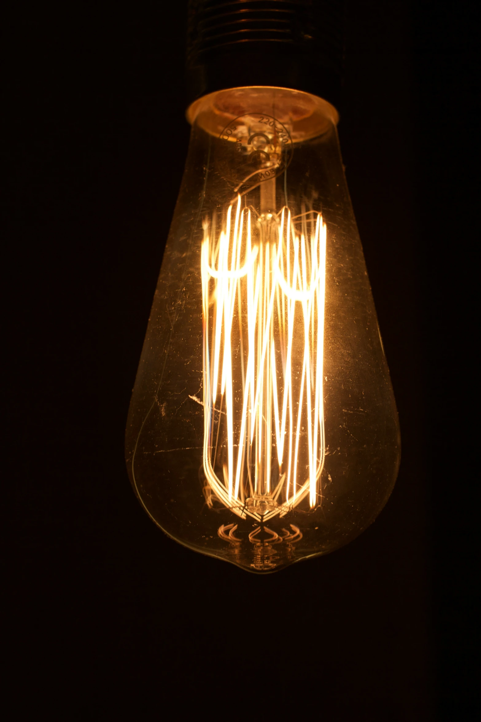 a lit bulb that is made up of wire