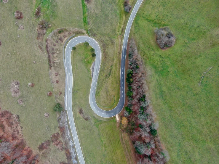 aerial po showing a winding road in the country