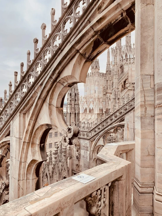 an ornate architecture and clock tower above a bridge