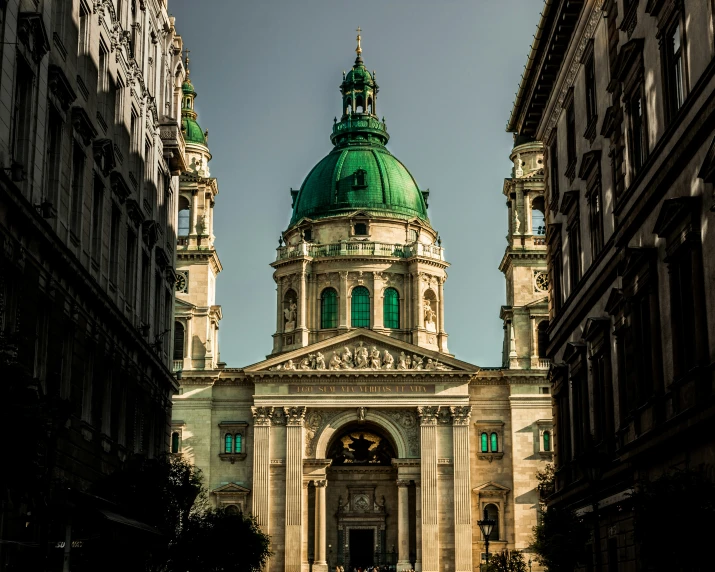 old buildings and steeple with an ornate green dome