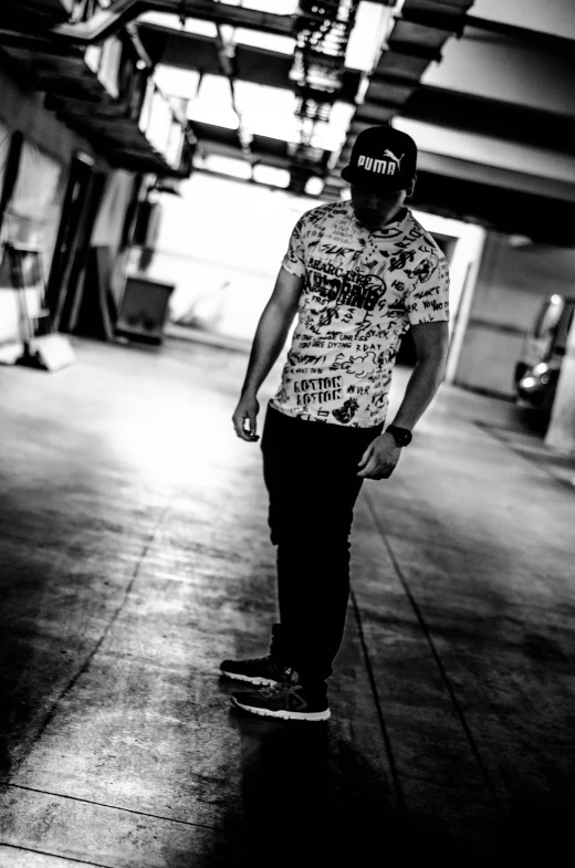 a young man is riding his skateboard in a parking garage