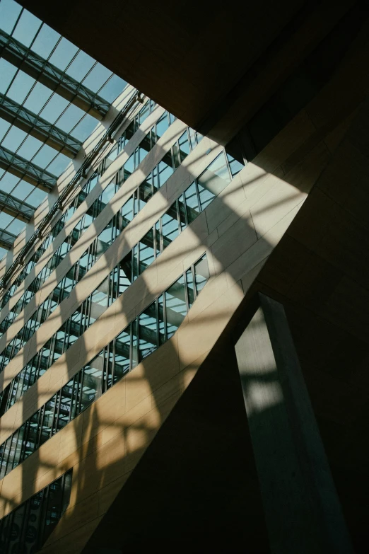 the ceiling of an open building has glass on it