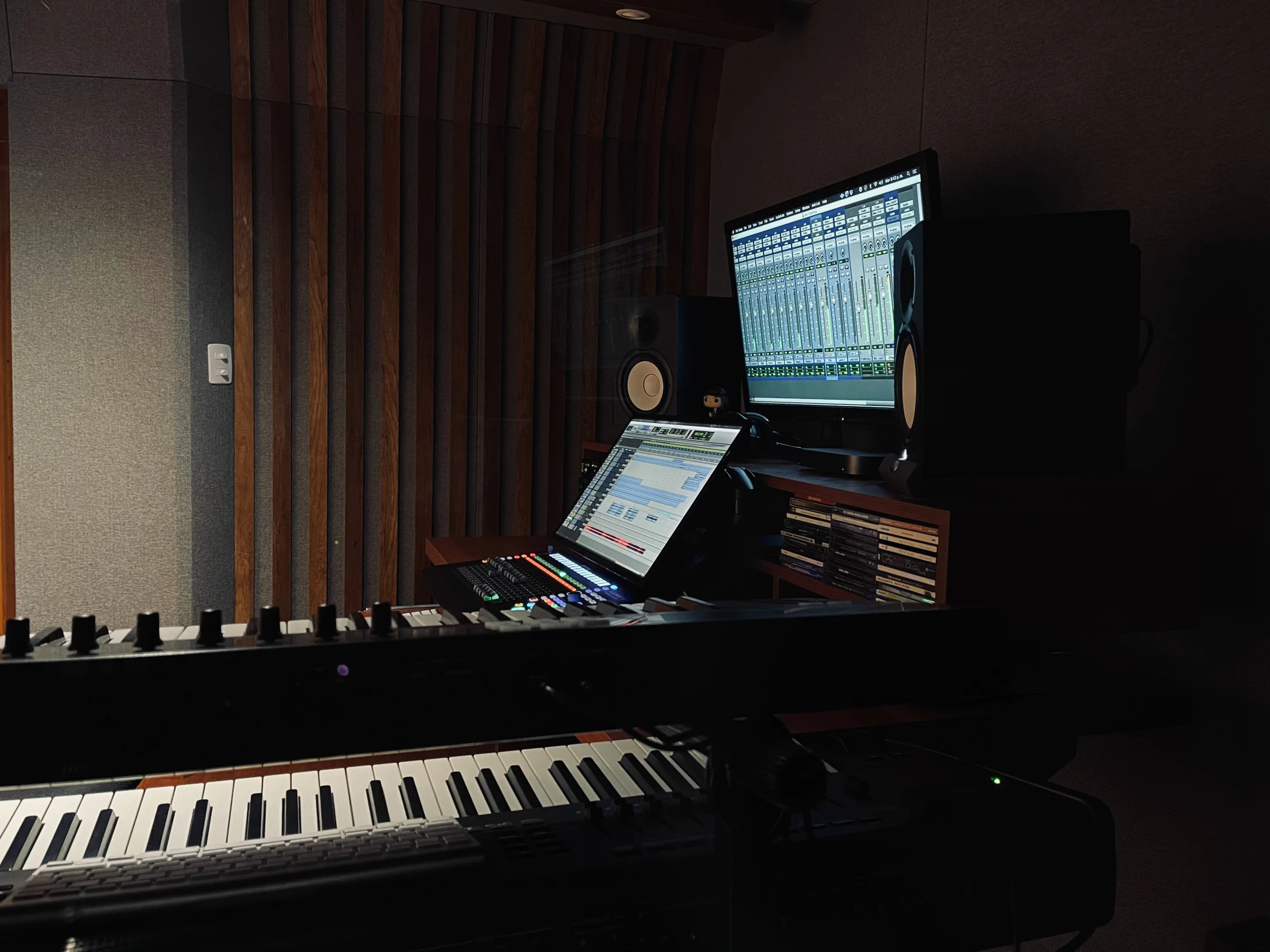 there is an electronic piano and sound board in the studio