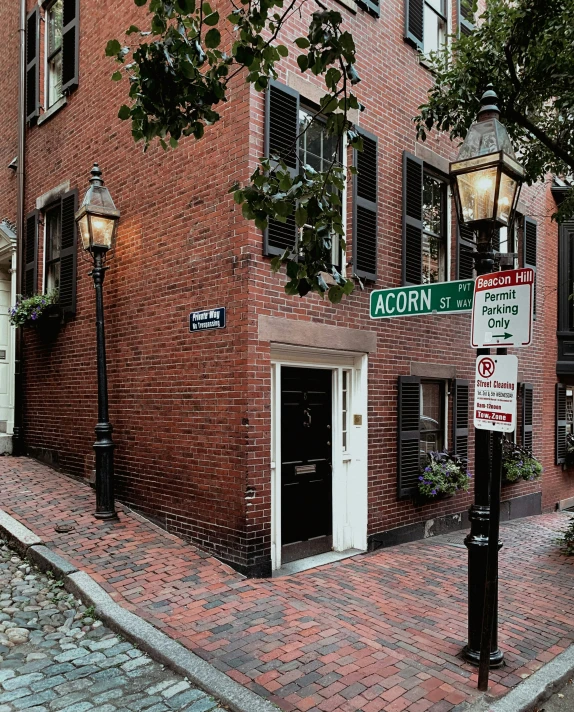 bricked building with two small doors in an area that has no people