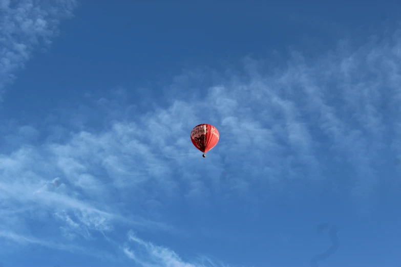 a  air balloon is seen in the sky