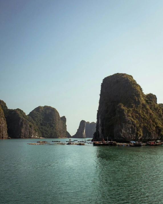 many boats in the water and some mountains