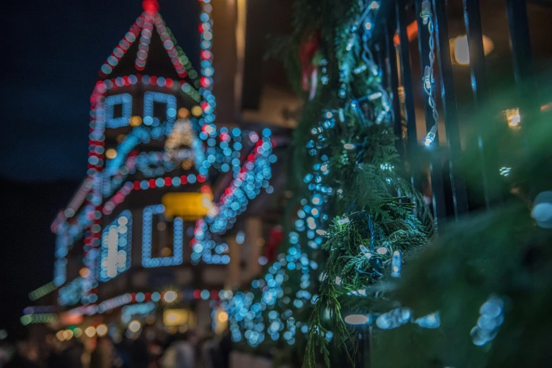 the lights of christmas trees on the street are lit up