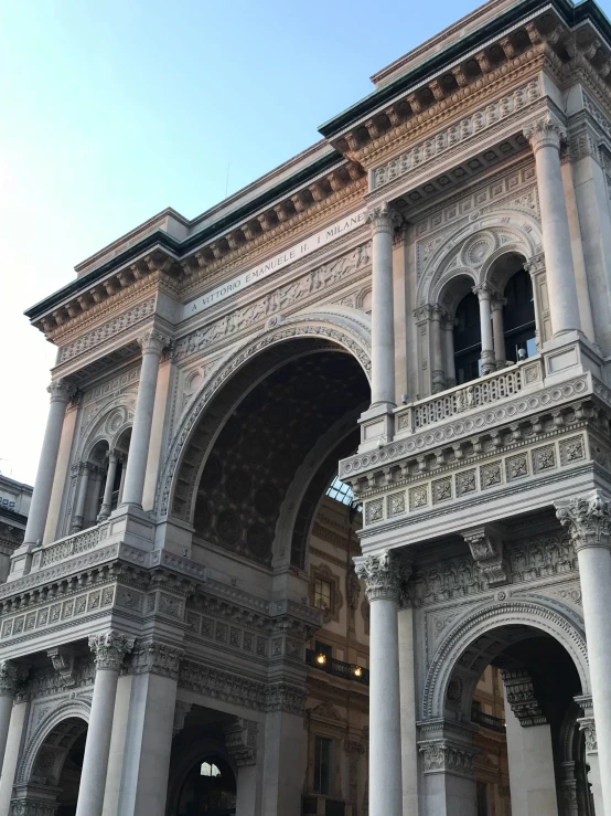 an ornately designed stone building with columns