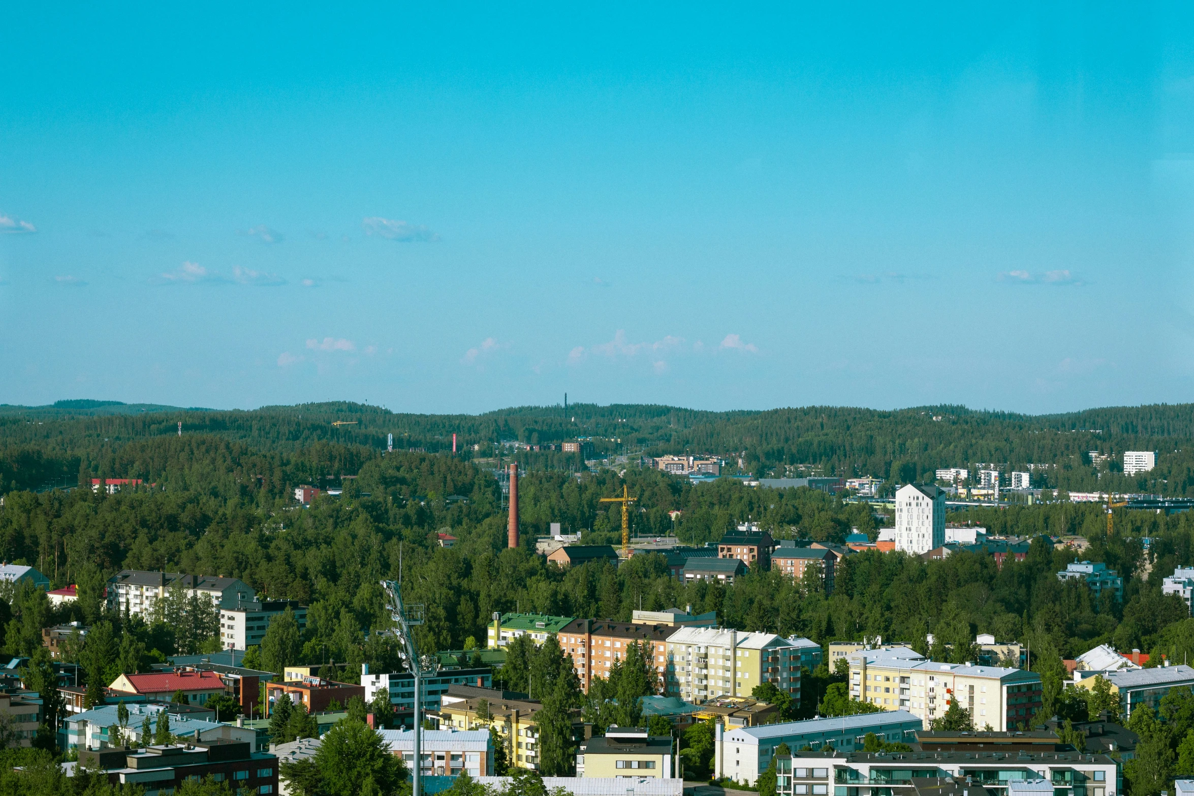 a town in the hills with trees and buildings