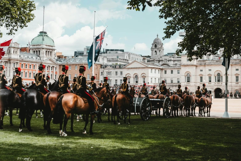 a group of men dressed in uniform riding horses