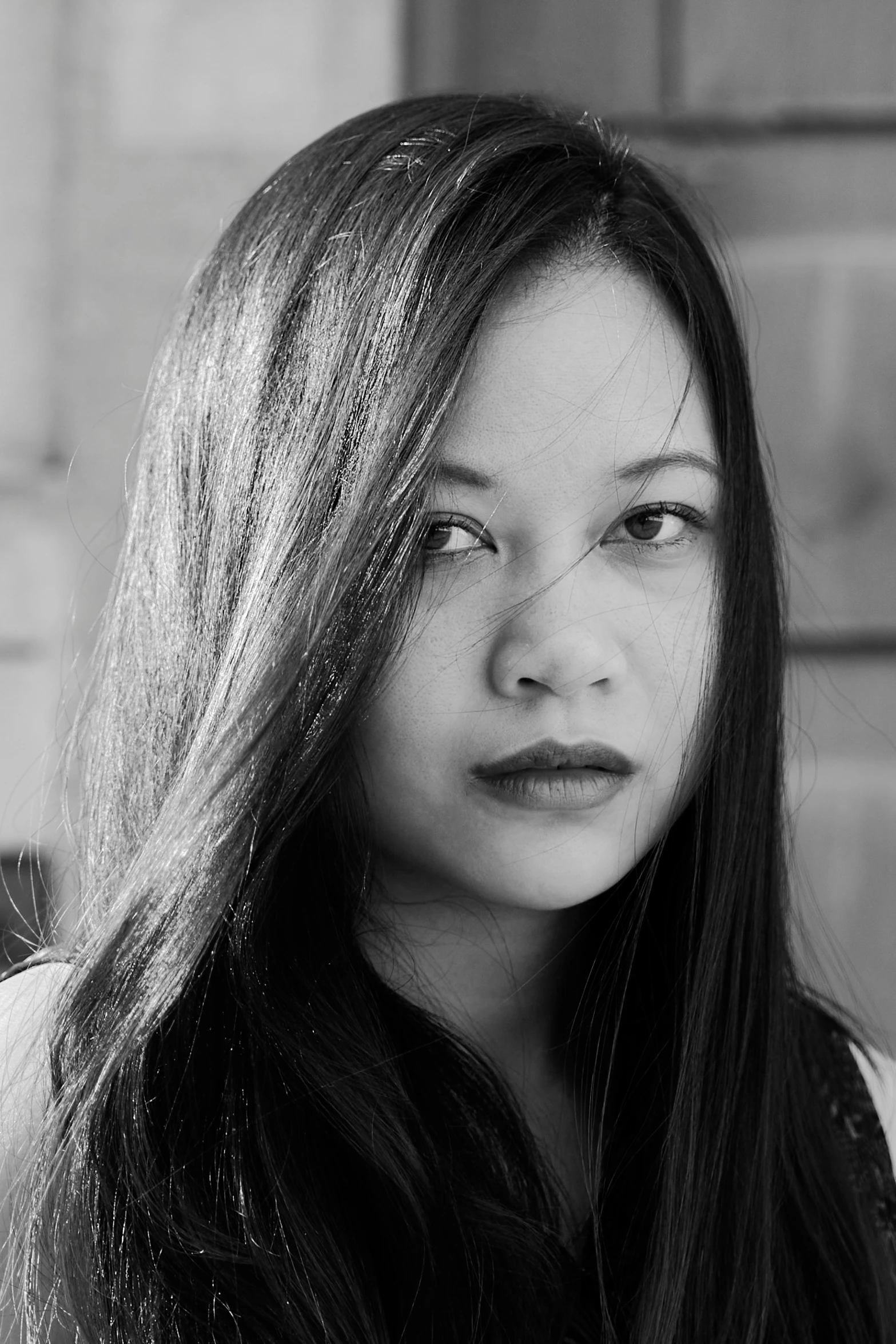 a woman with long brown hair is staring