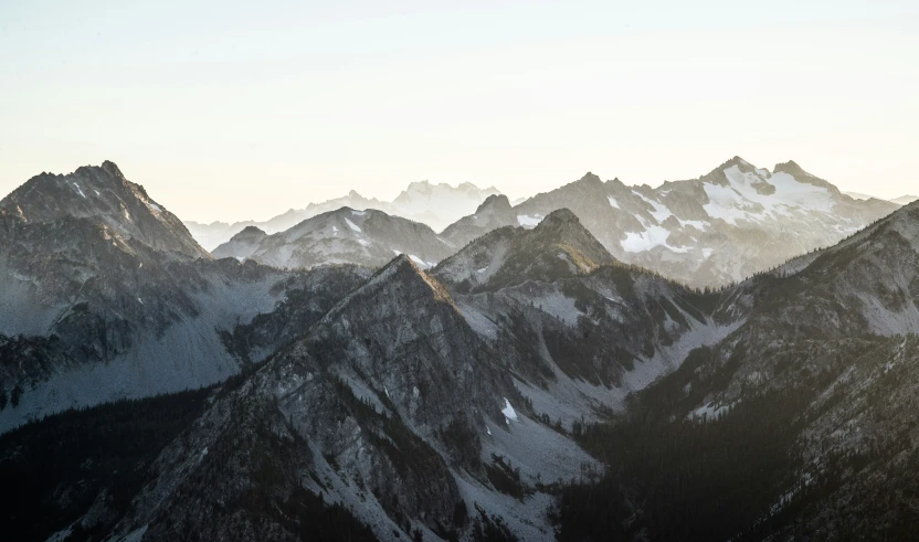 the tops of the mountains that are snowed