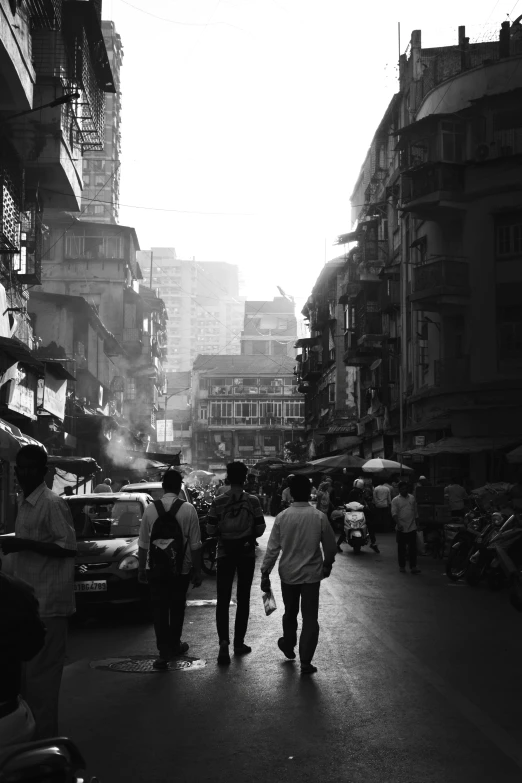 a group of men walking through a street