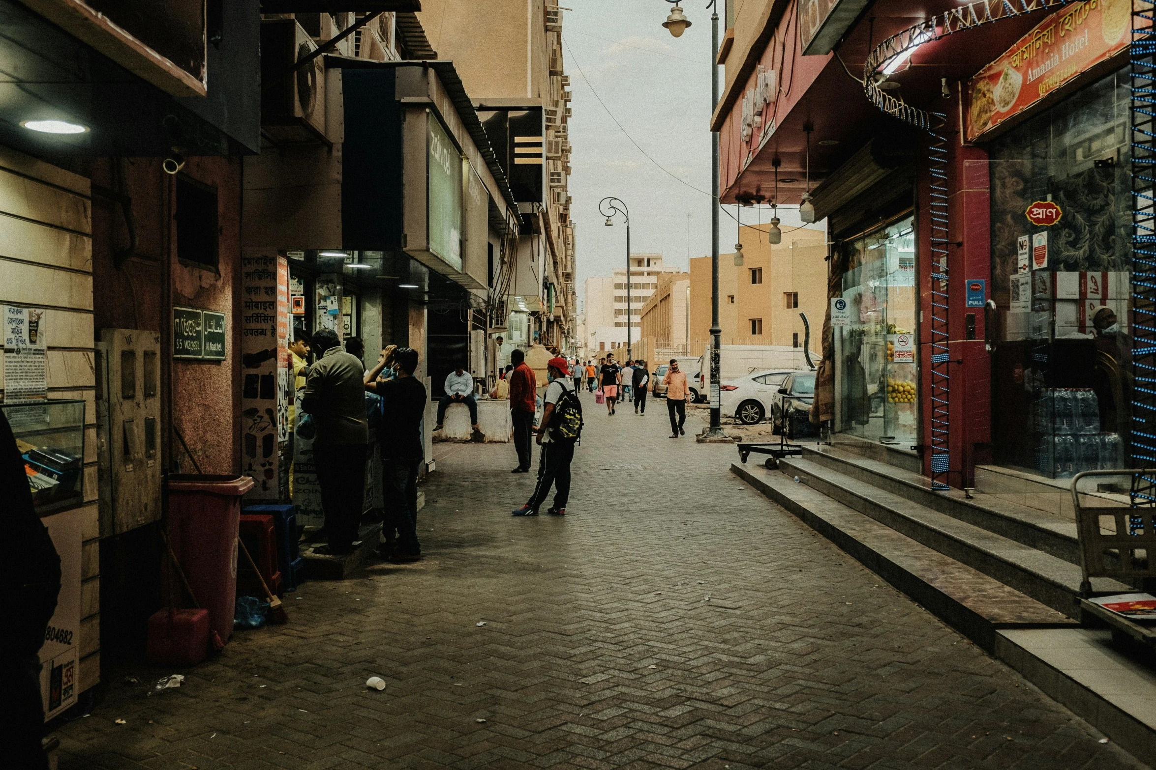 there are people walking down this street together