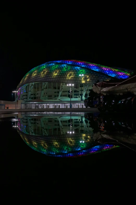 a big building with the lights on is shown