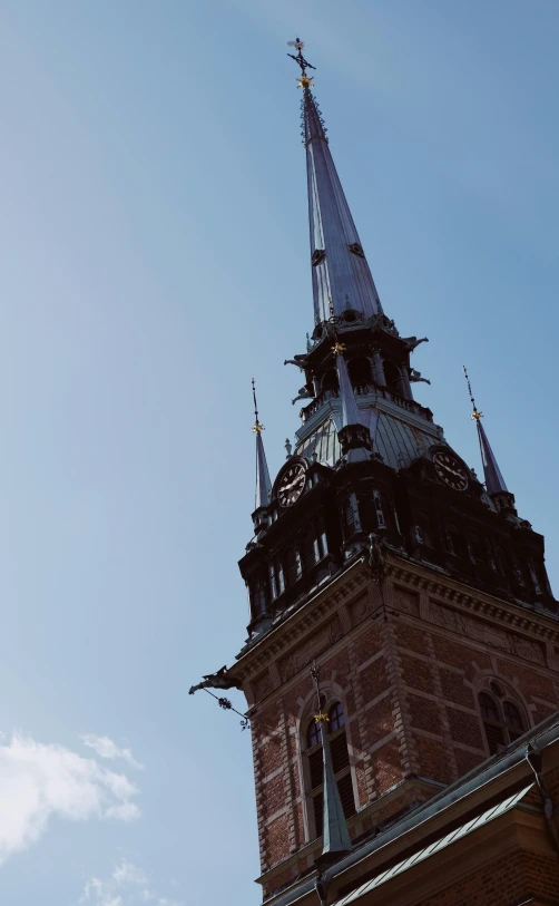 the top of the tower with a clock displayed on it