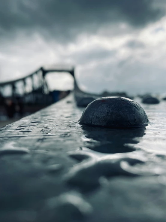 an ice covered boulder floating on top of a body of water