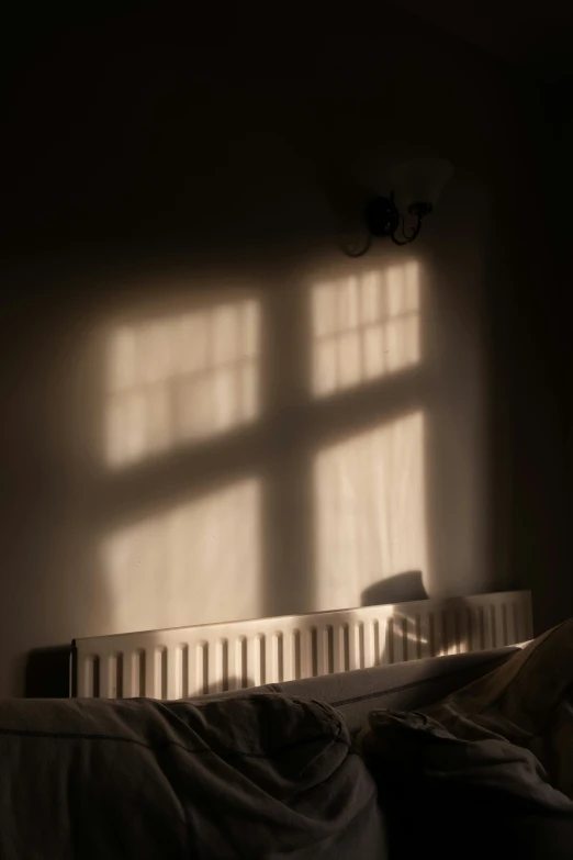 shadows are cast on the bed in the bedroom