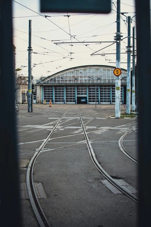 this is an empty train station, with tracks to the right