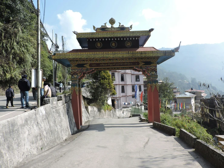 a very tall arch on top of a street