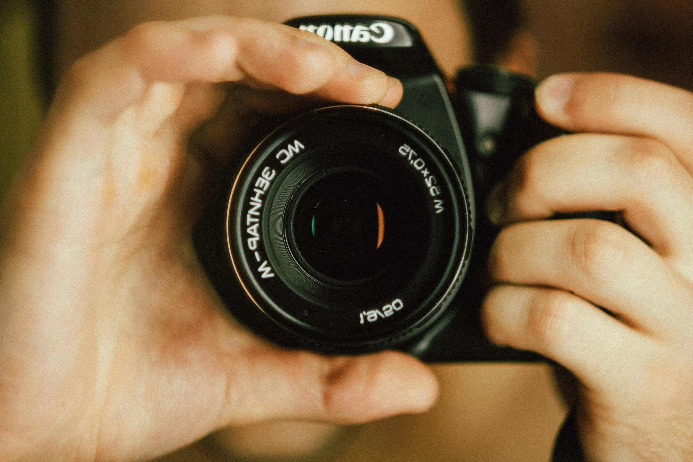 a man is taking a pograph with his camera