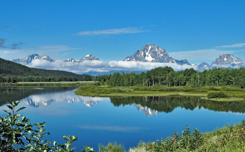 this is a mountain range by a small lake