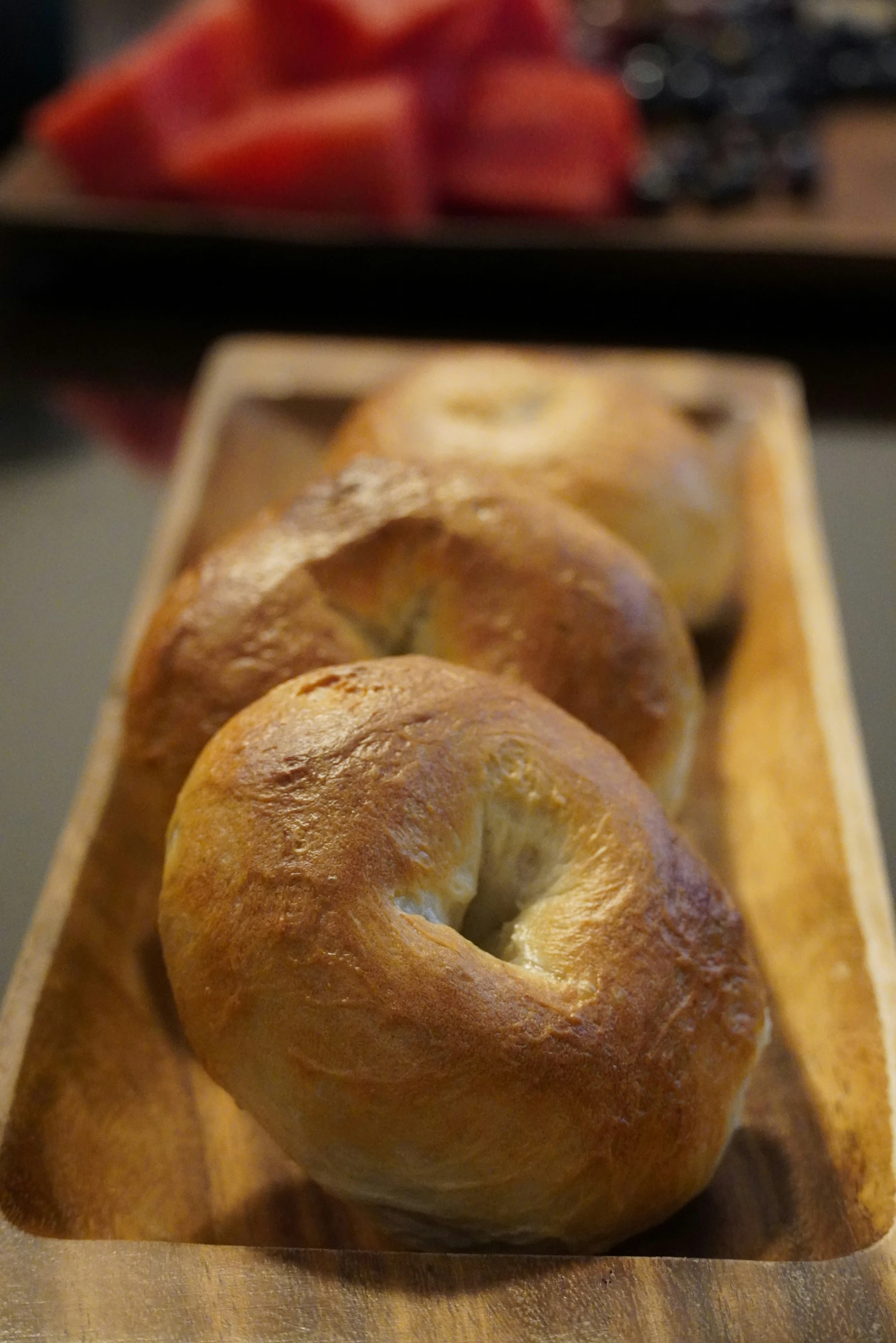 a  board filled with bagels on top of it